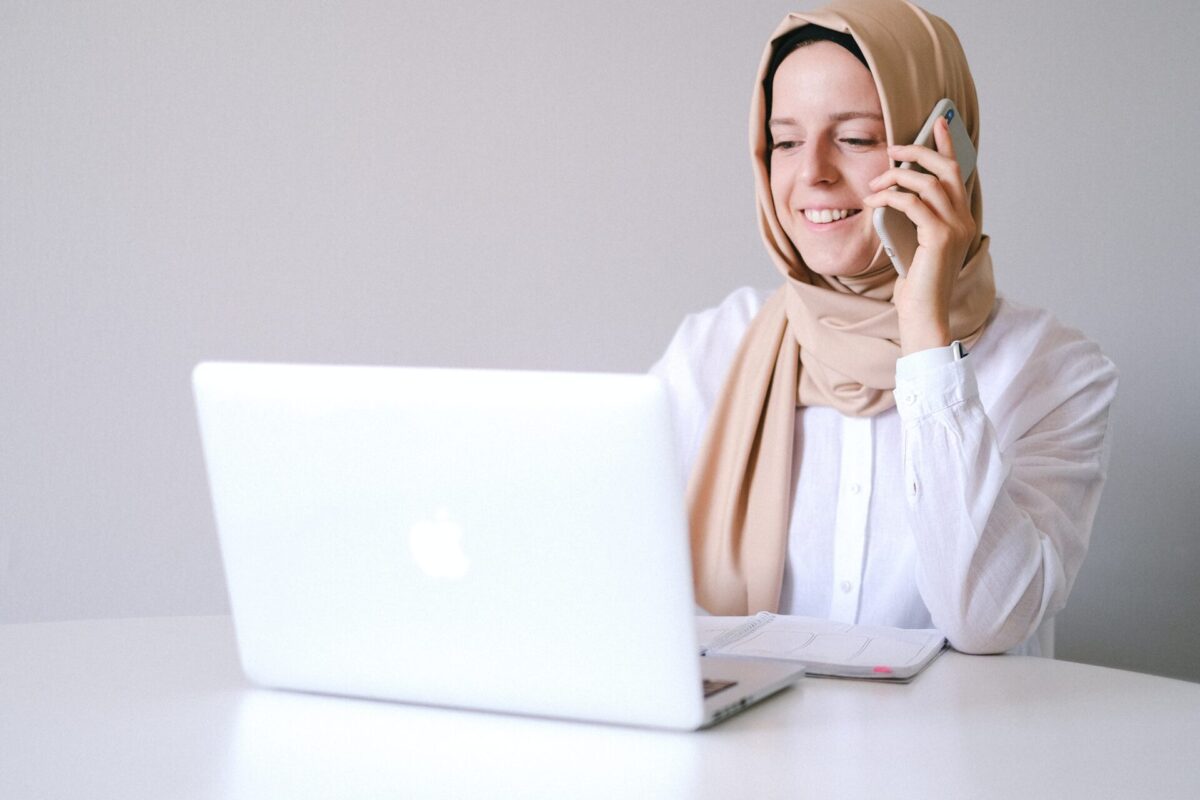 a women with a scarf in an online meeting