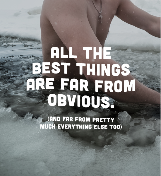 Man swimming in a frozen lake. Text caption "All the best things are far from obvious. (And far from pretty much everything else too)