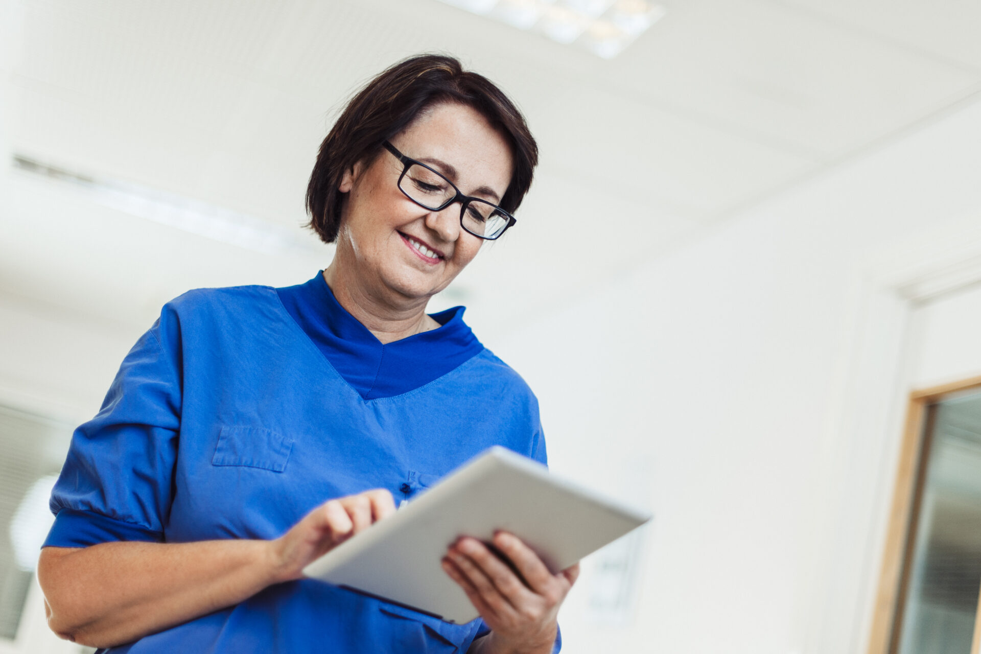 Nurse in hospital with digital tablet.