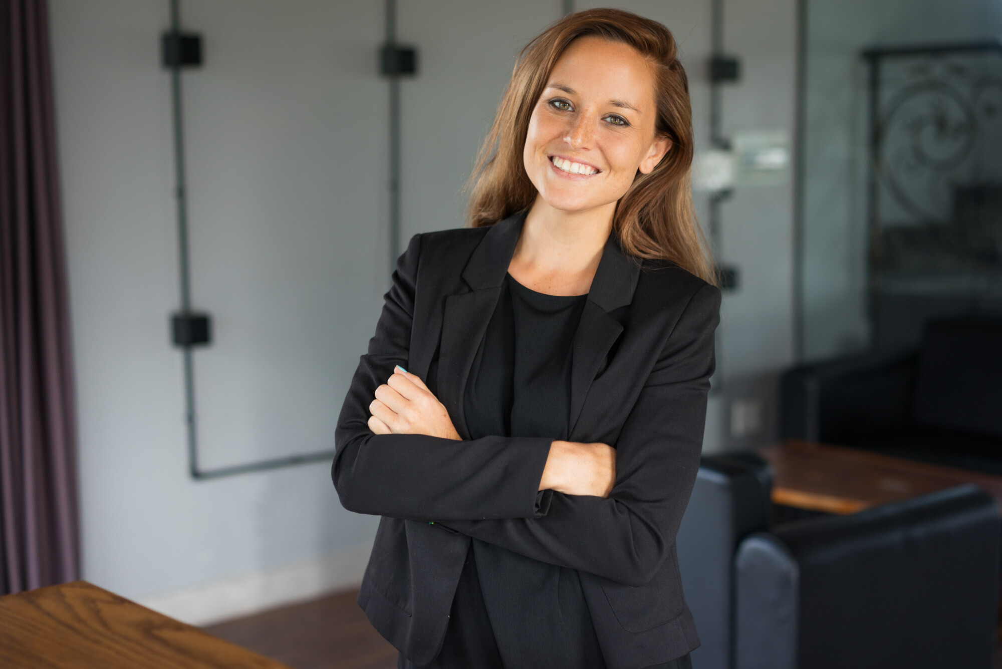 Smiling Beautiful Business Woman in Hotel Lounge