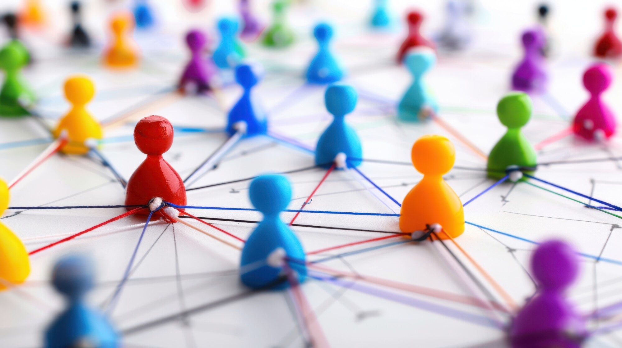 Pins on a map with strings attached between them.