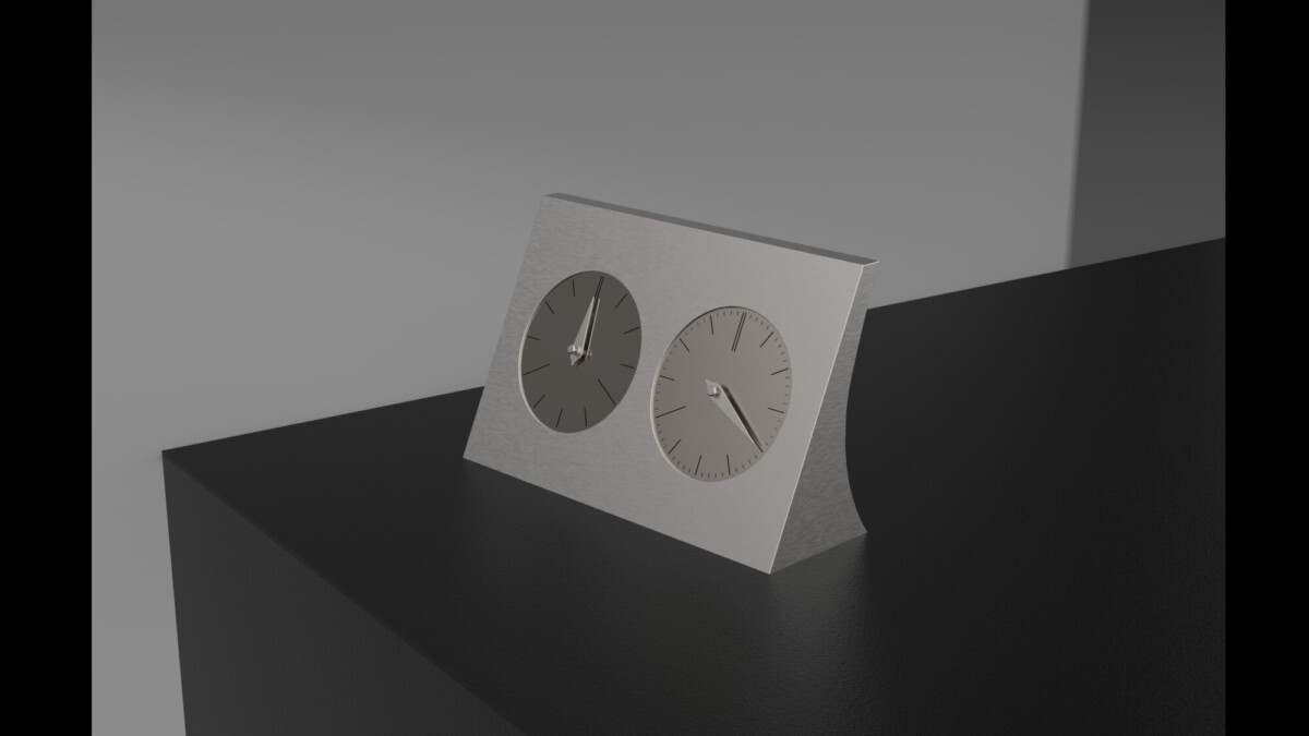 Hopeinen kaksoiskello istuu tummalla, kulmikkaalla pinnalla. Kummallakin kellotaululla on eri kellonaika, ja tausta on pelkkä harmaa, mikä luo minimalistisen kokonaisuuden.