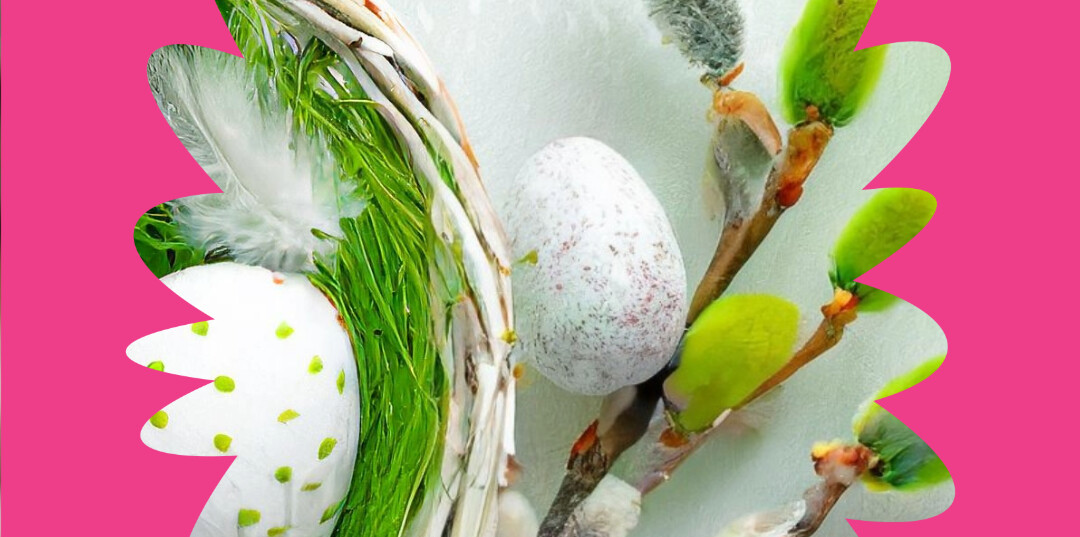 Koristeellisia munia, vihreitä lehtiä ja pajun oksia valkoisessa korissa valkoista taustaa vasten, jossa on roosa reunus.