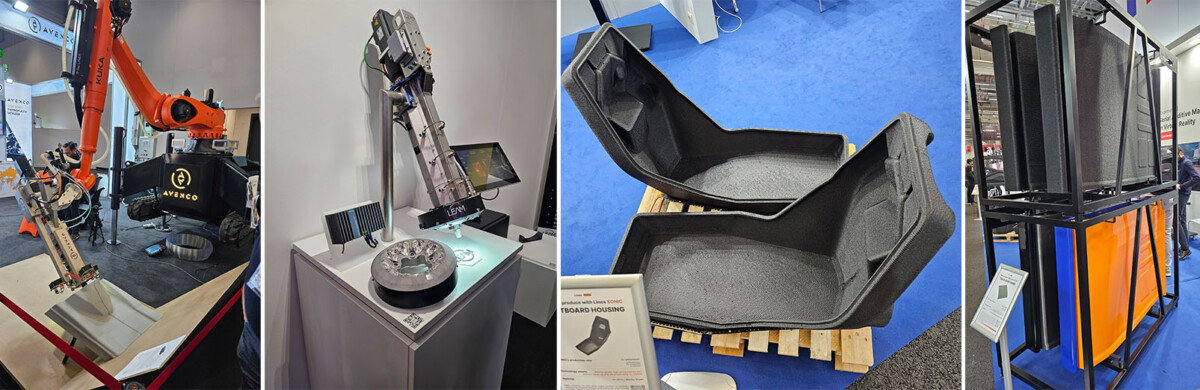 Neliruutuinen kuva, jossa näkyy: oranssi robottikäsivarsi, robottitulostuspää led-lämmittimillä, kaksi suurta mustaa 3D-tulostettua osaa kuormalavalla sekä korkeita mustia rekan kattopaneeleita näyttelytelineessä messuilla.