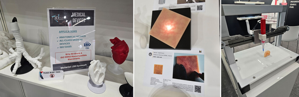 Lääketieteellisten laitteiden prototyyppejä, kuten anatomisia malleja, punainen sydänmalli, silikoninen ihotyyny ja 3D-tulostin, joka esittelee biotulostusta, näytteillä näyttelyosastolla.